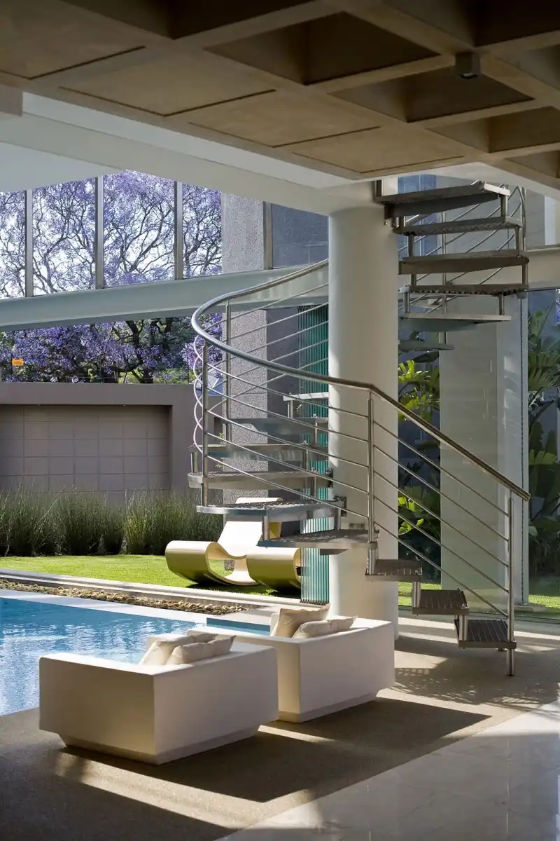 Glass house with a circular staircase
