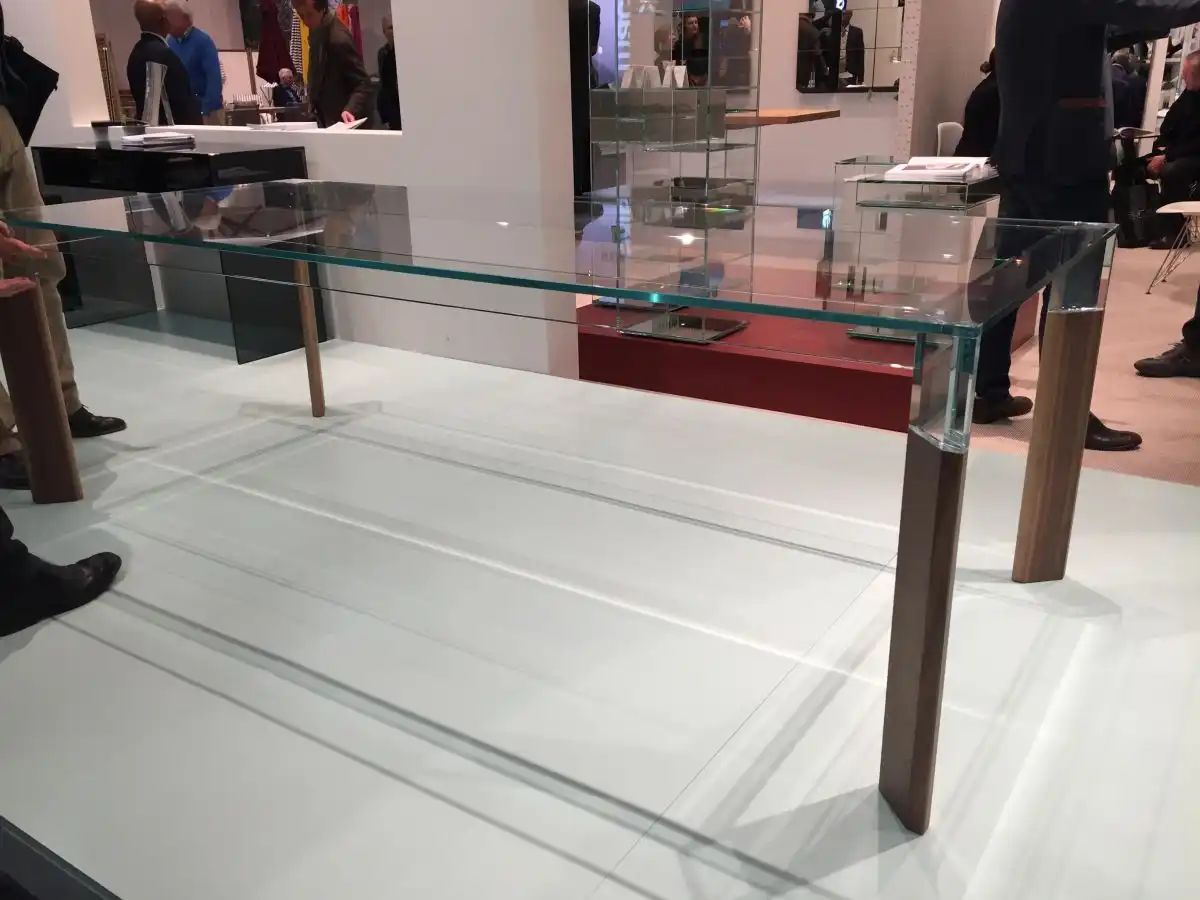 Glass top table with a wood base