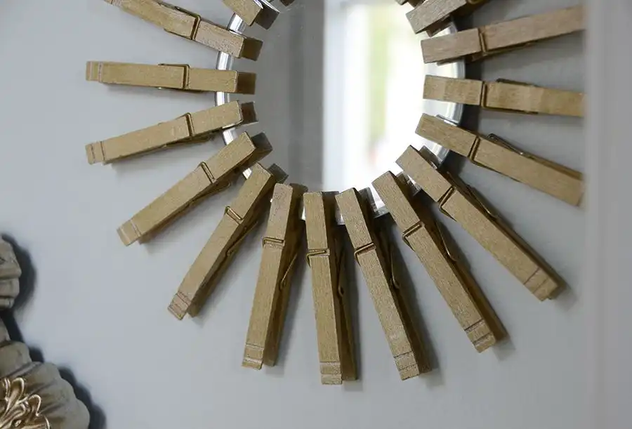 Gold Starburst Mirror With Clothespins