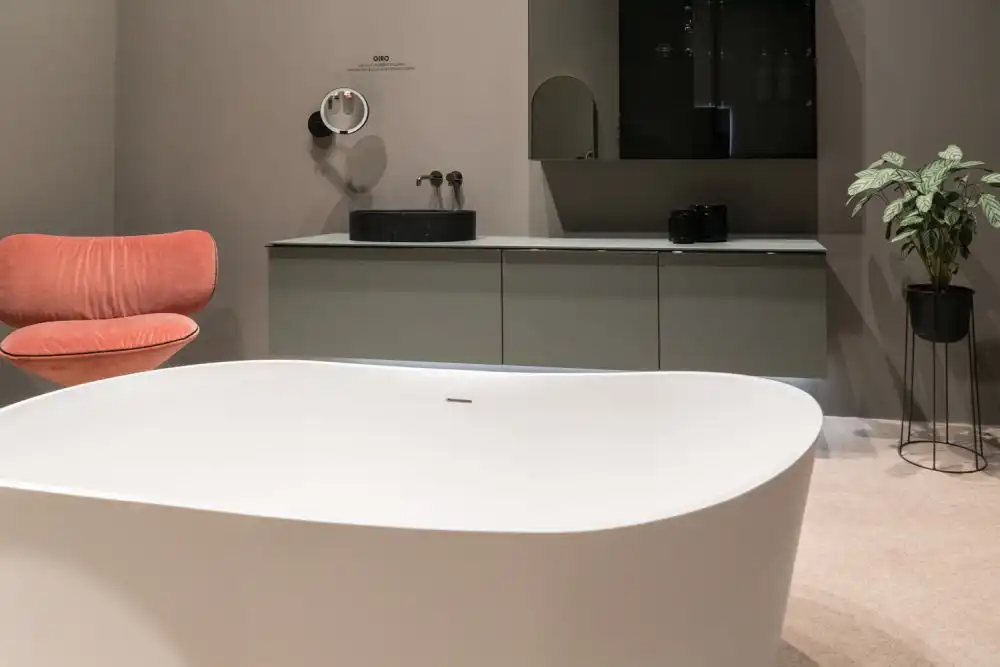 Gray bathroom cabinets with curved bathroom tub