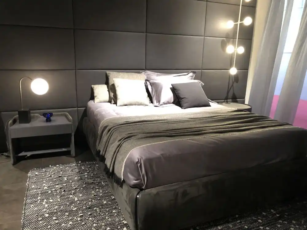 Gray geometric floor to ceiling headboard