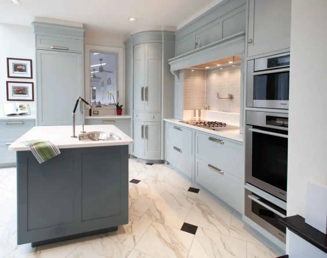 Gray kitchen design with curved doors for corner cabinet