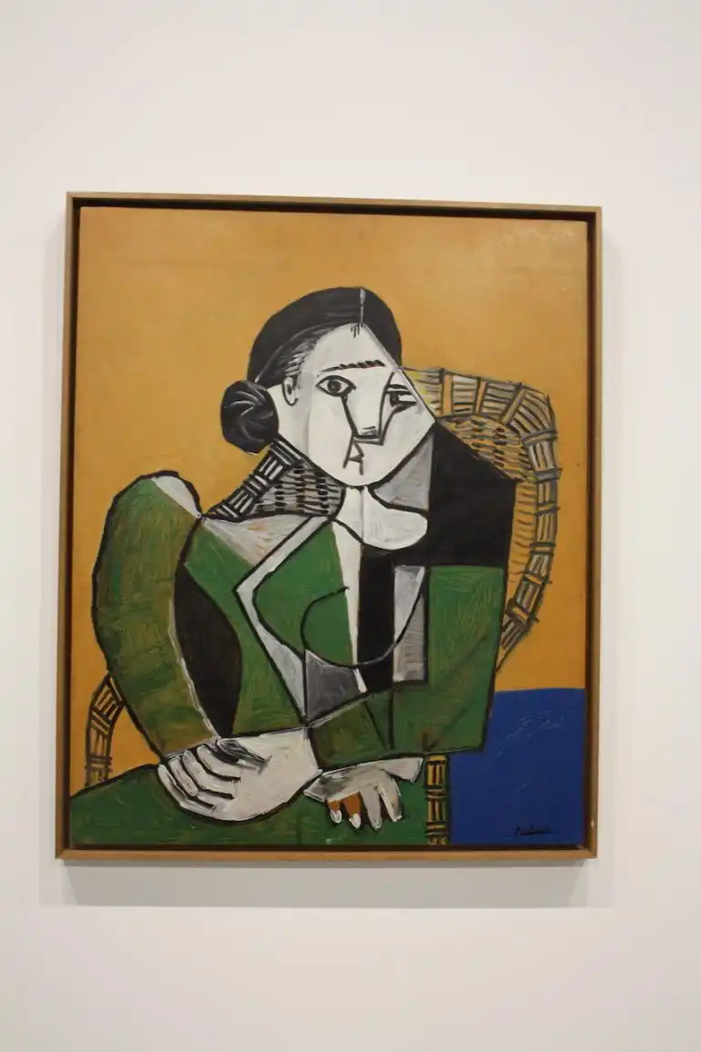 1950s Woman In Green Sitting In A Chair