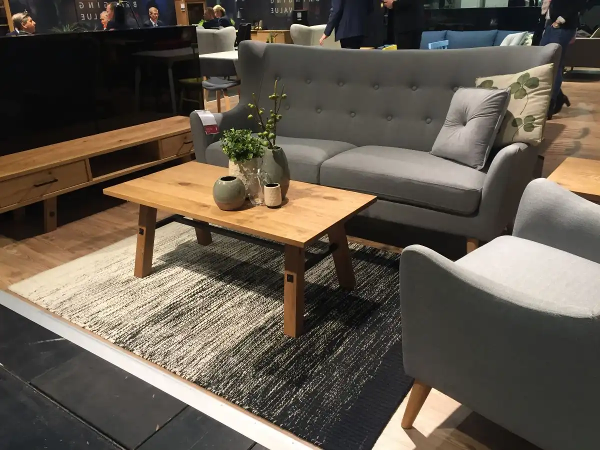Grey sofa and armchair with a wood tall coffee table