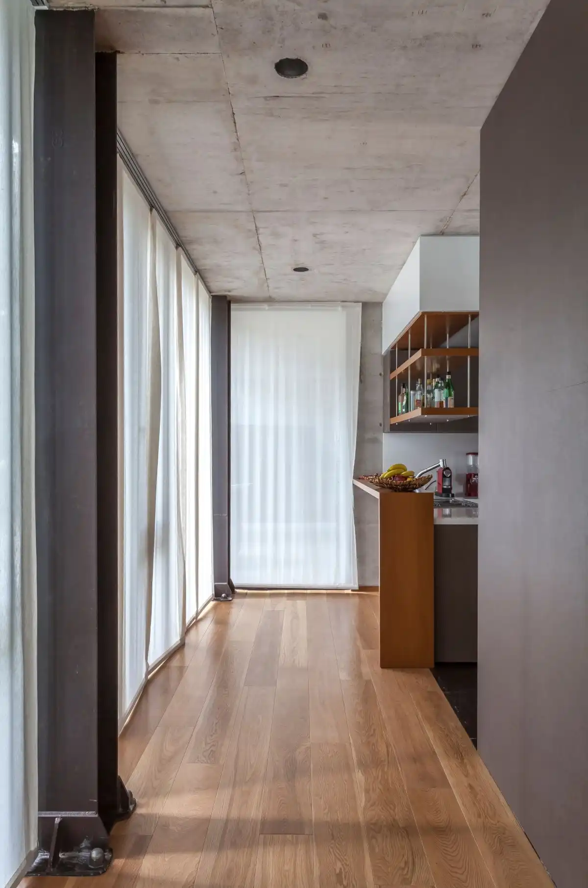 The hall to the kitchen offers a look at the various design details.