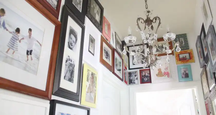 photo wall ideas Hallway Gallery with Mismatched Frames