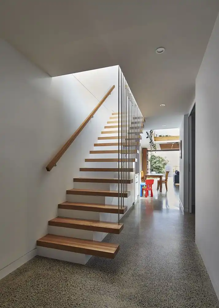 Hallway staircase with terrazzo floor