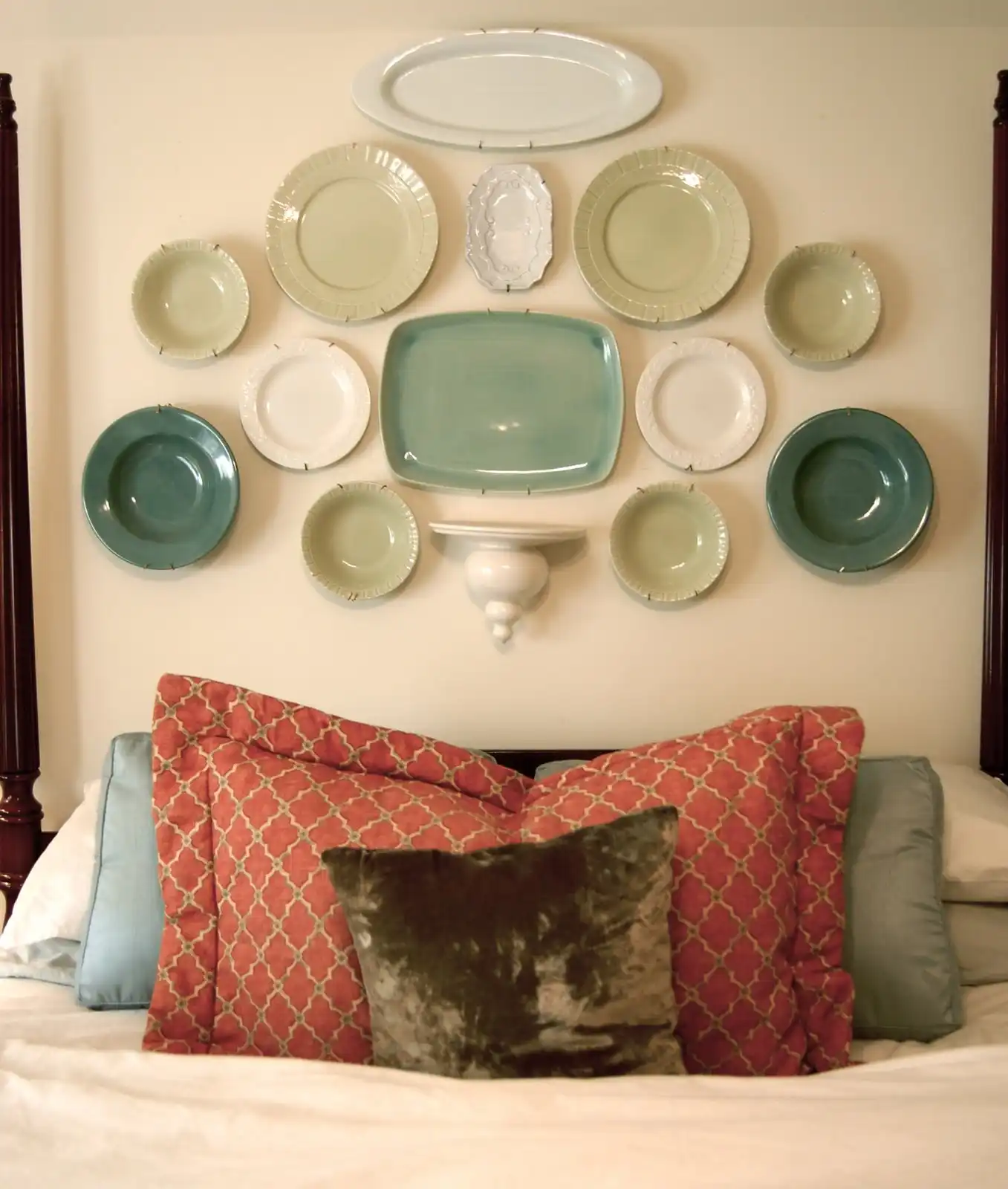 Hang plates above the bed like headboard