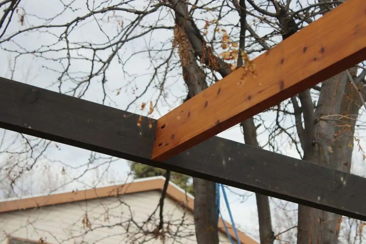 How to Install Modern Pergola Rafters Without Brackets - first rafter installed