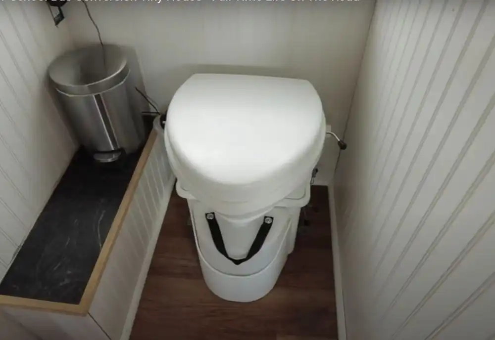 High School Sweethearts in their Melody Machine Bus Reno Bathroom