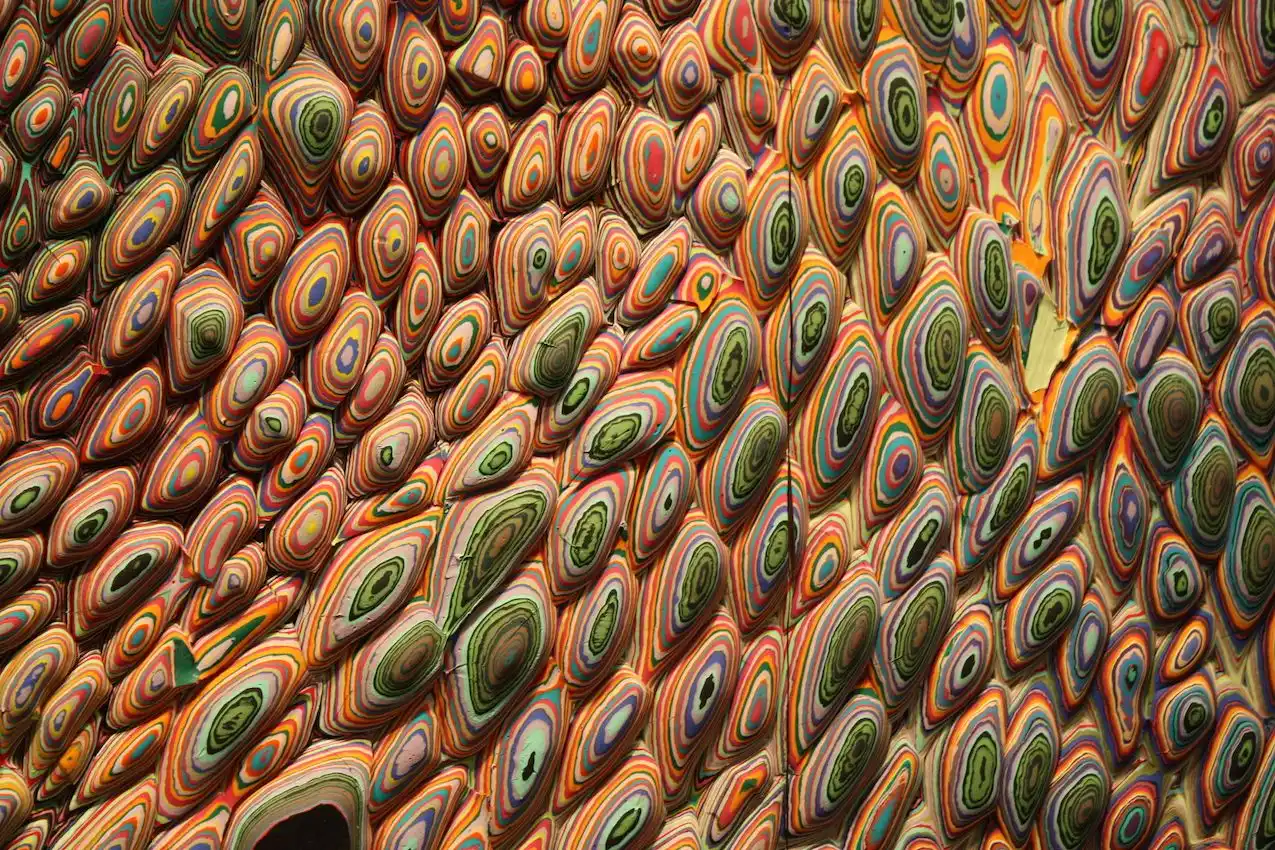 These close-ups show the different layers of paint pours that are applied to small pieces of wood and then assembled into the massive wall piece.