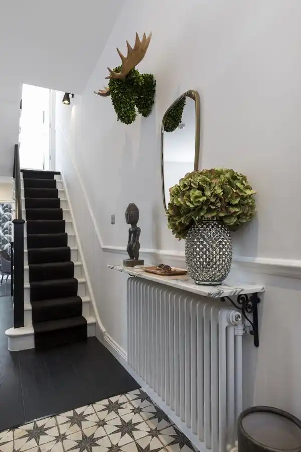 Home Foyer in London with Green Accents