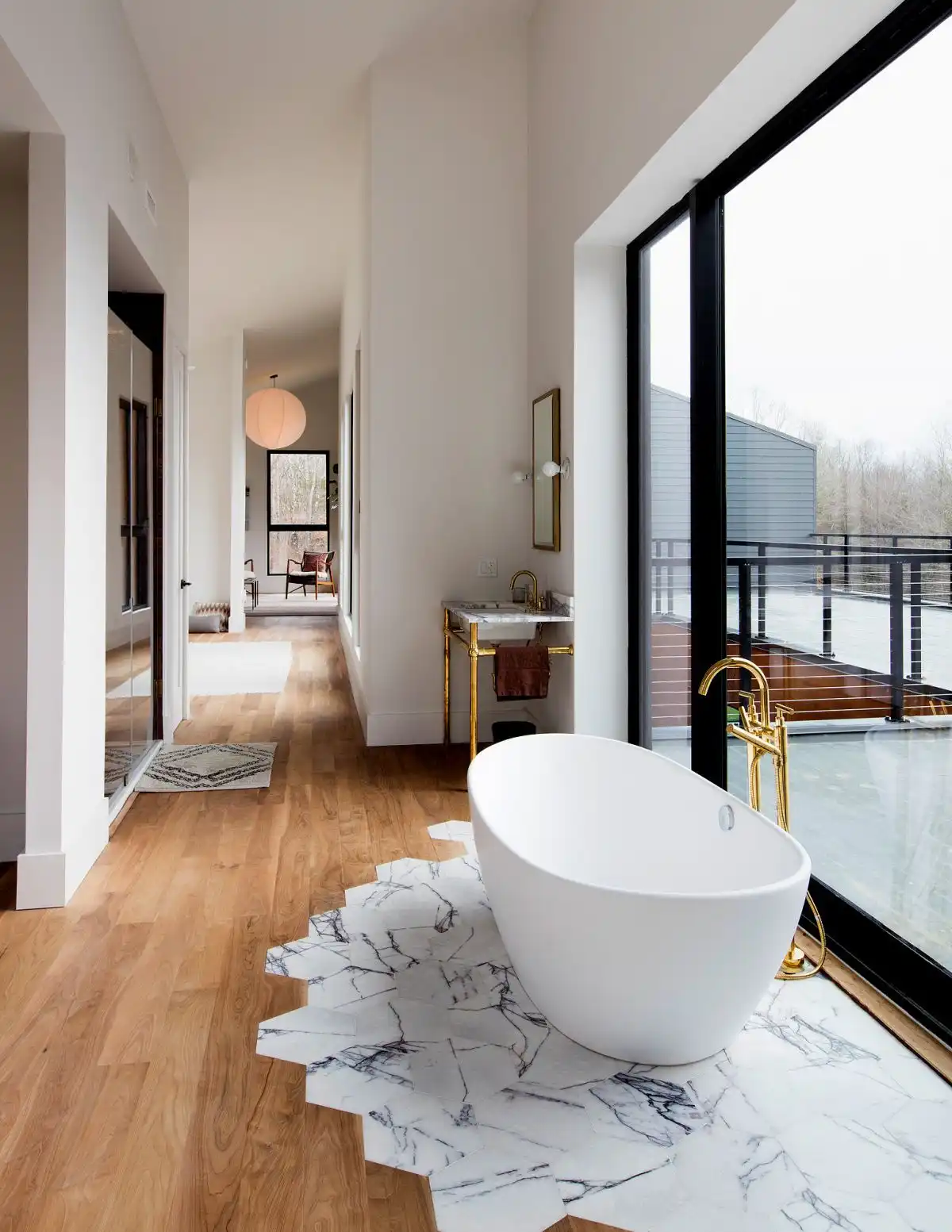 Honeycomb marble tiles with wood floor