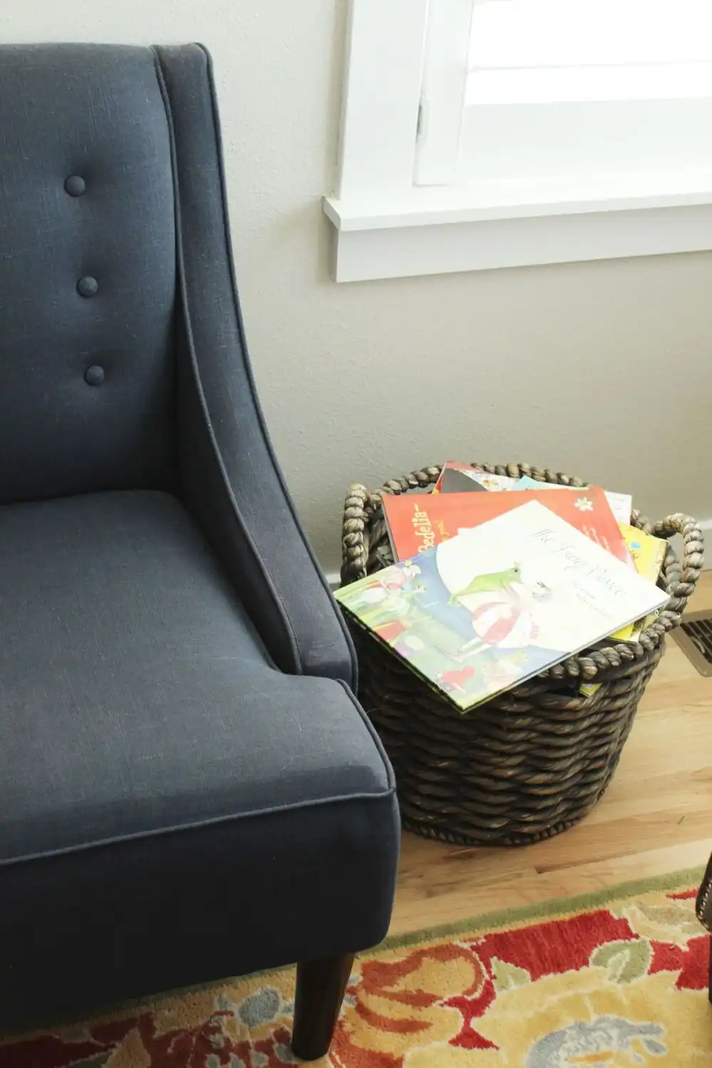How to Decorate Living Room - tufted chair and rattan storage basket