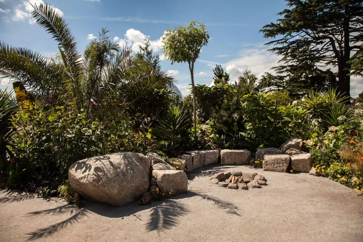 Large stones or blocks can serve both as decorations and as benches in a garden