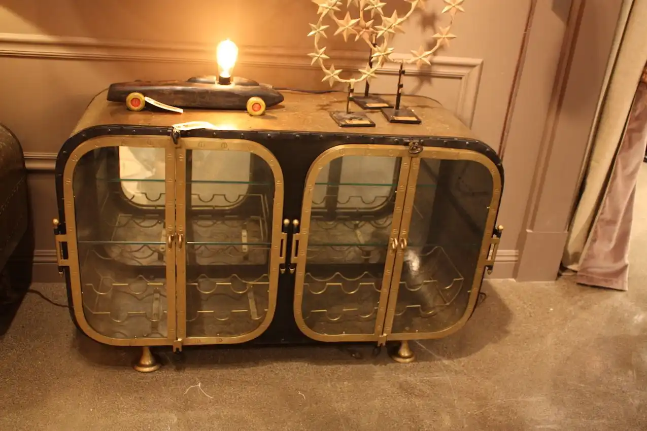 A number of unique elements make this console/wine storage cabinet a real conversation piece.