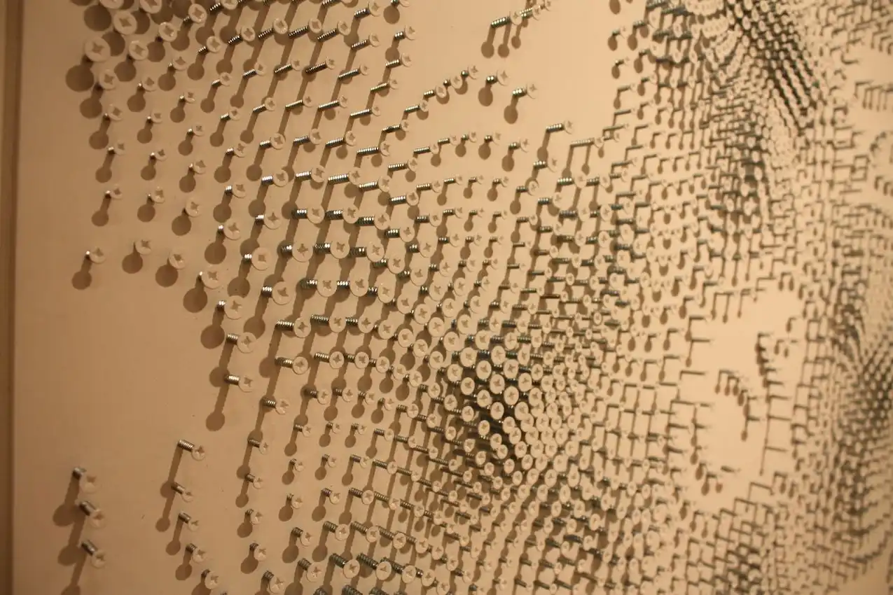 Tanner precisely places all the screws to fashion the impressive pieces.