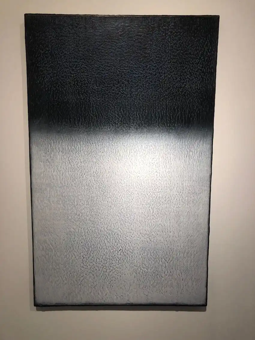 Subtle texture plays up the drama of this stark piece.