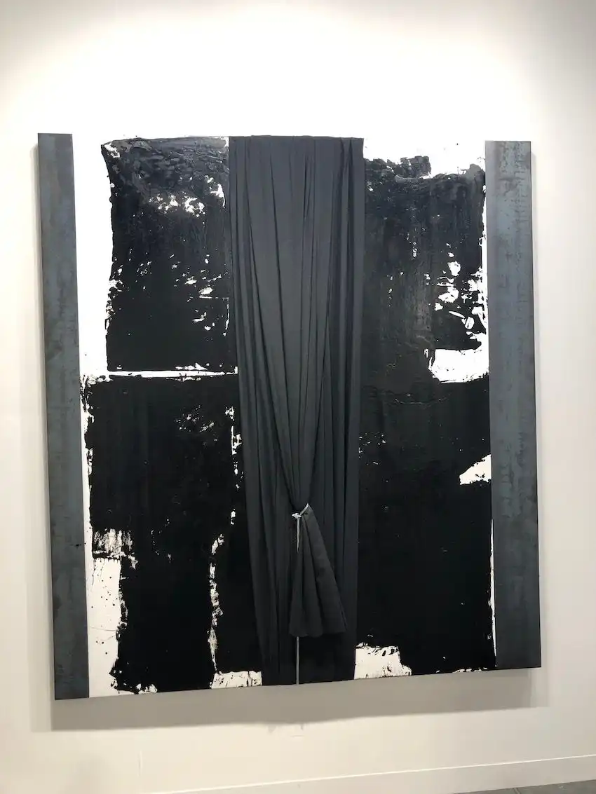 Artworks with mixed materials always ad dimension to a feature wall.