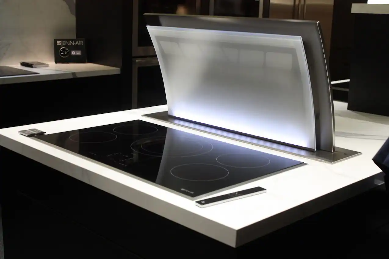 Today's sleek cooktops pair well with retractable vent hoods.