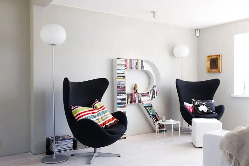 Kids room with two upholstered black egg chair