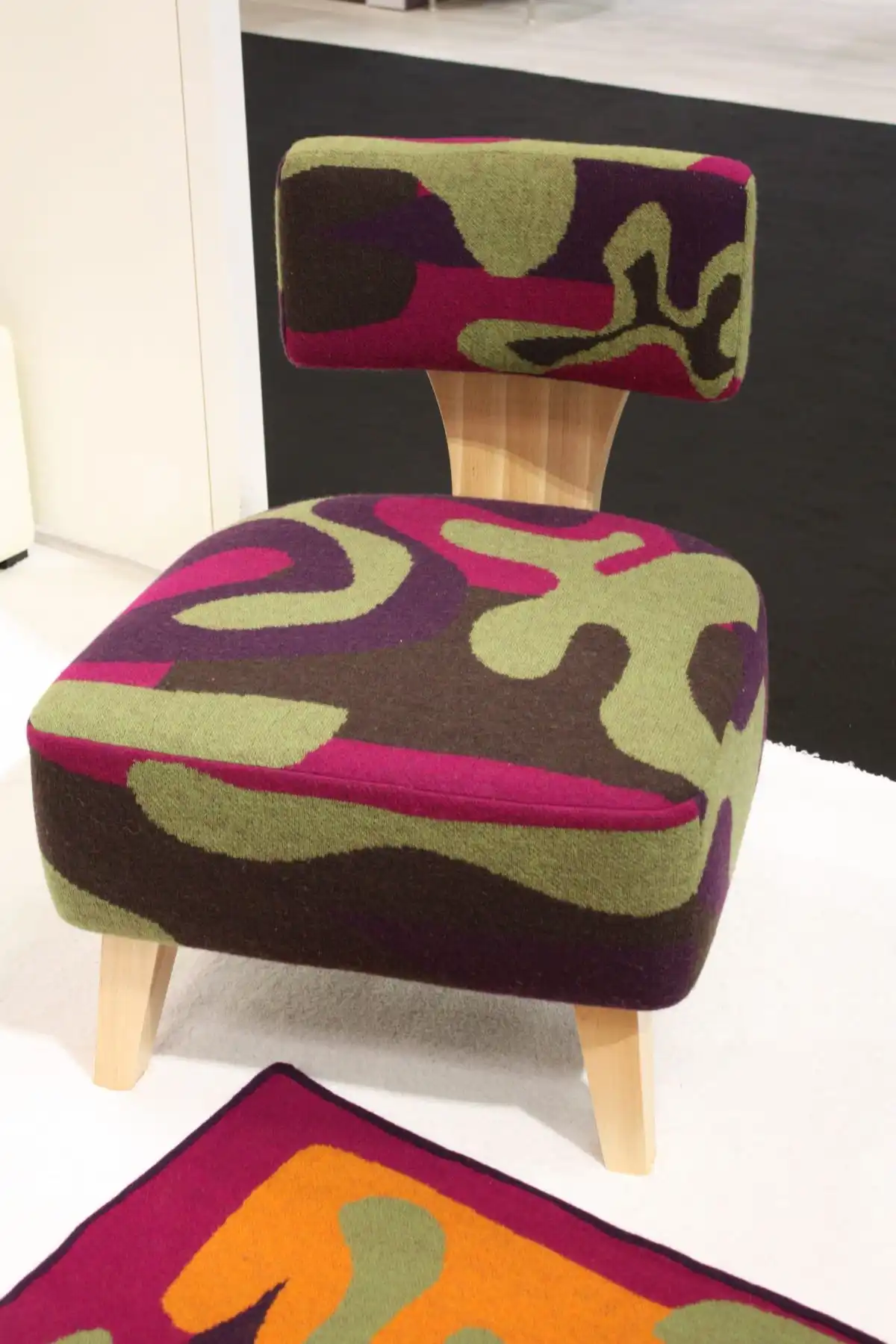 Modern slipper chairs can feature different shapes and bold upholstery.