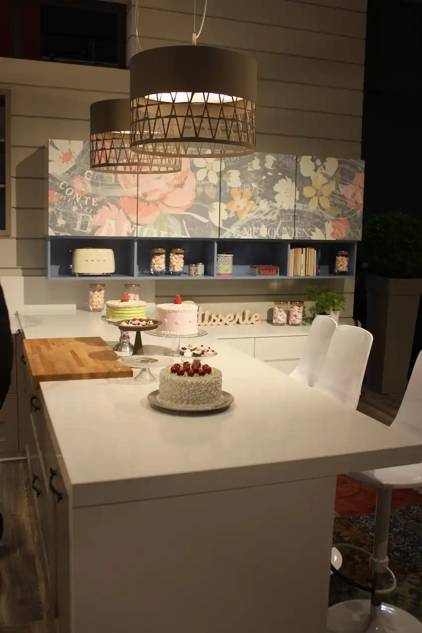 Another kitchen by Arrex was as pink and pretty as a pastry, featuring these drum-shaped kitchen pendant lights. The lattice detail at the bottom of the shade keeps the style light and appropriate for the happy space.