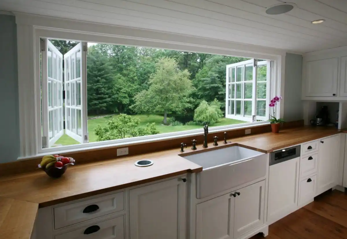 Kitchen with accordion panel windows