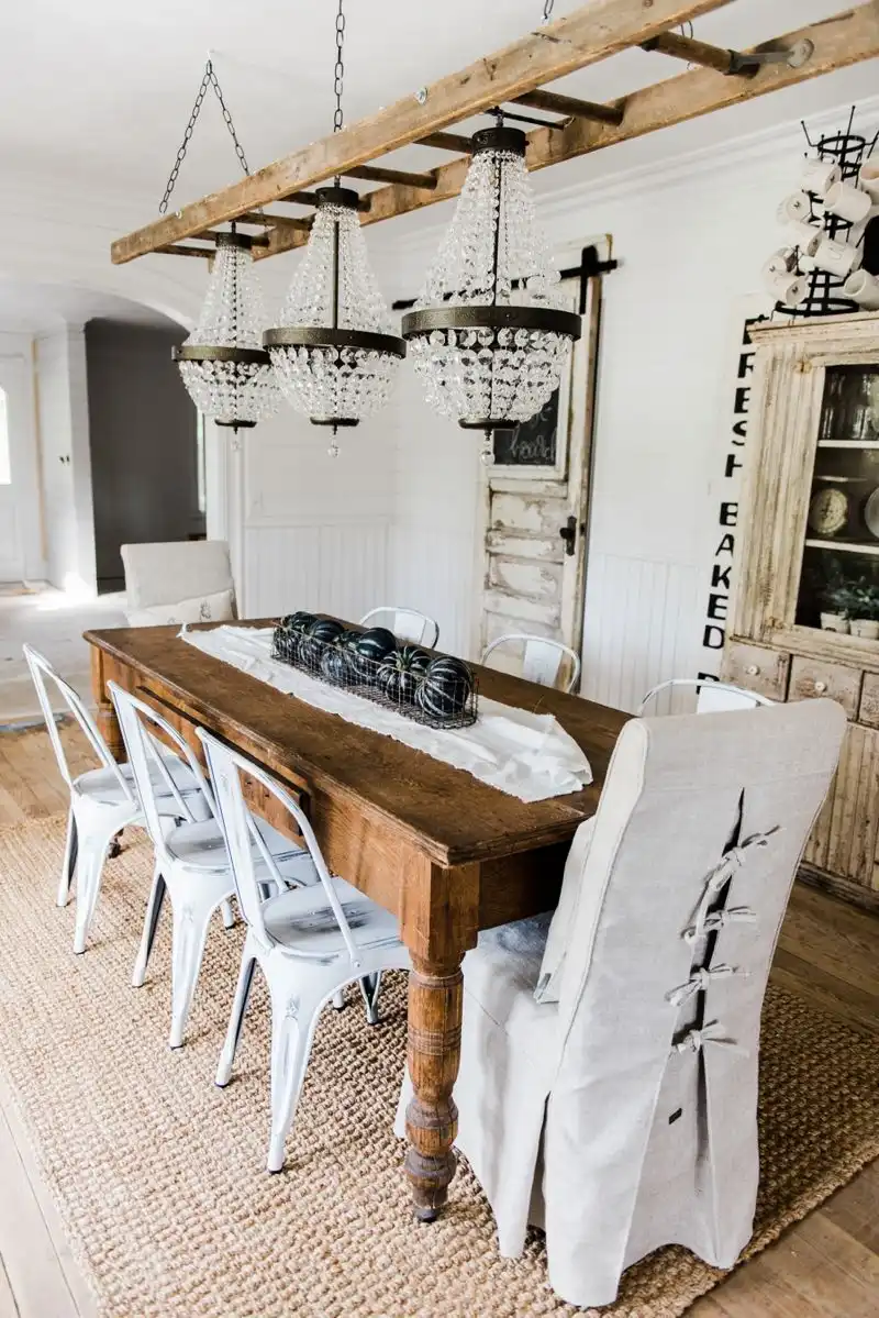 Ladder chandelier hanging above dining table