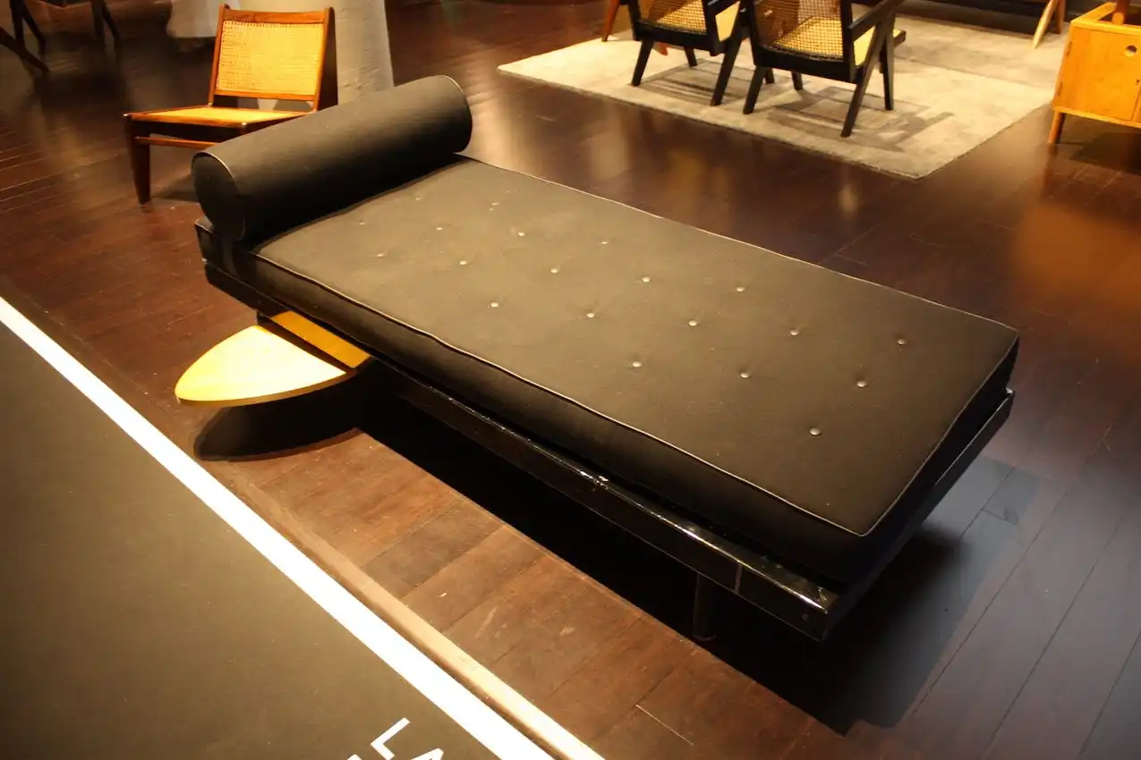 The elegant roll and tufted seat are classic.