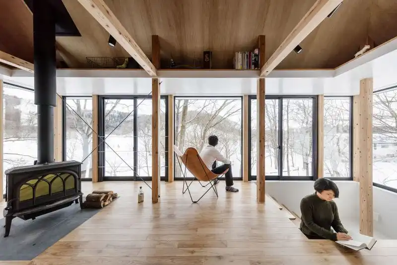 Lakeside cottage with a fresh design perspective fireplace