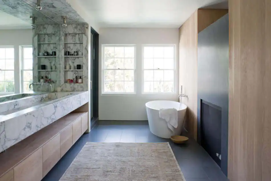 Large bathroom with grey accents and freestandign tub