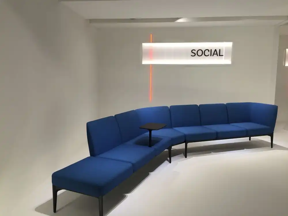 Large blue curved sofa