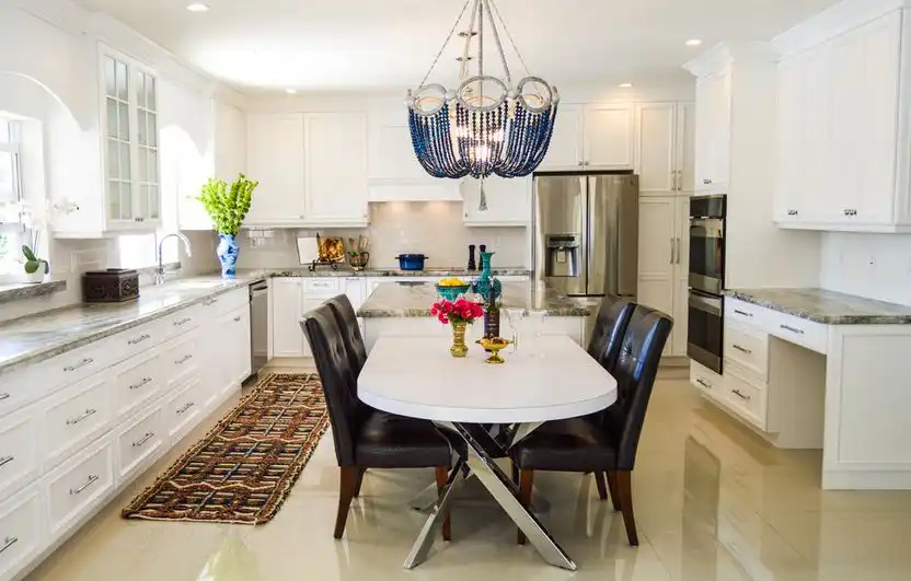 Large kitchen with beaded chandelier over table