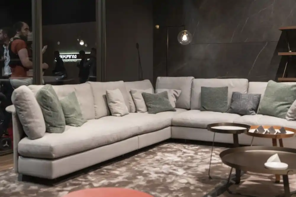 Large l shaped sofa and floor light grey walls