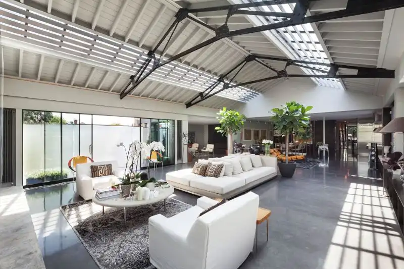 Large open space living room with poted trees