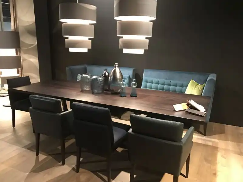 Large rectangular table with bench and tufted chairs