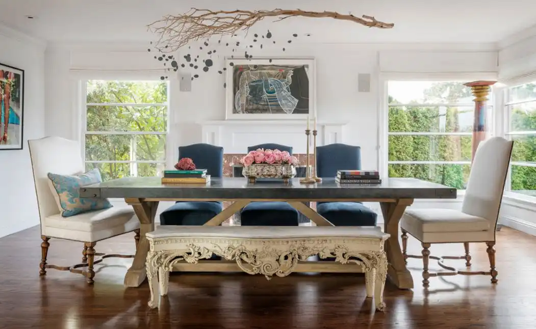 Large trestle dining table with branch over it