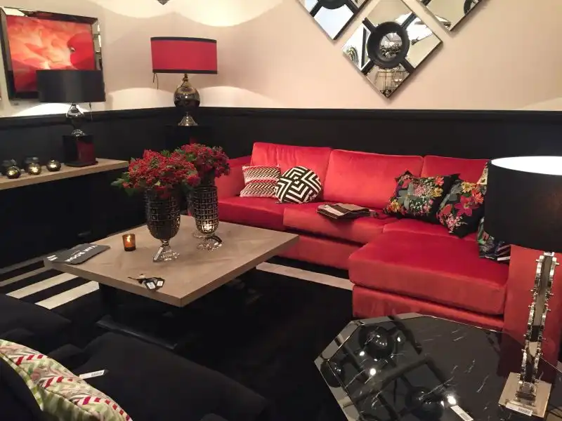 Large vases with red flowers on the coffee table