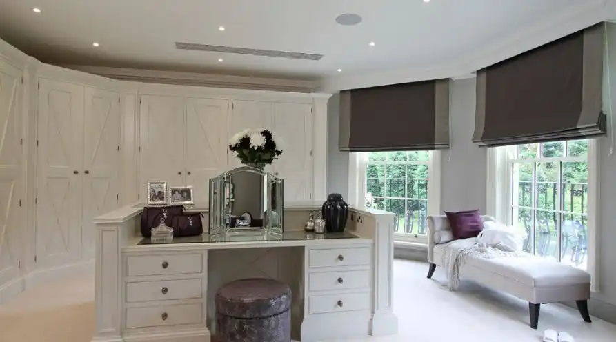 Large walk in closet with seating