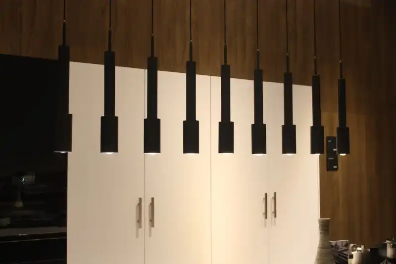 Another minimalist kitchen lighting fixture with a big impact is this small black pendant that was in the Leicht booth. When hung in multiples in a linear fashion, these small spots provide enough light to function as kitchen island lighting.