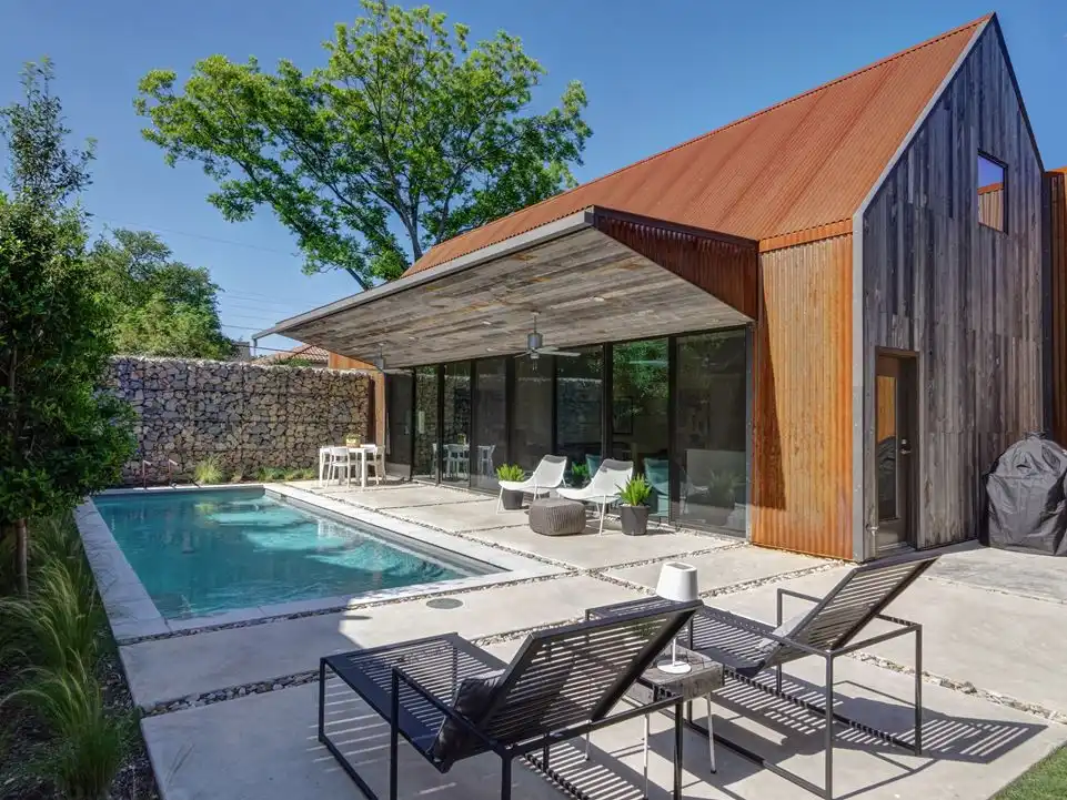 The pool and living areas are situated near the front of the house.