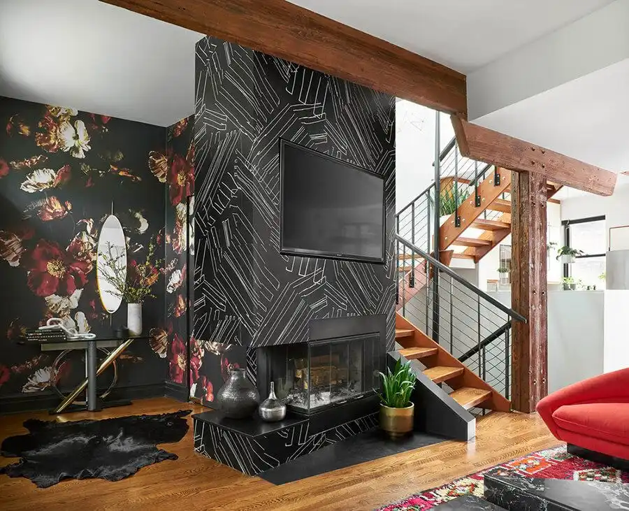 Living Room with a black fireplace with white stripes and a flowery wall