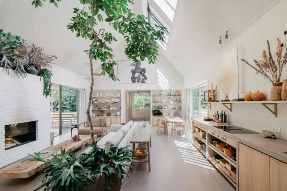 Living Room with tree inside and white fireplace