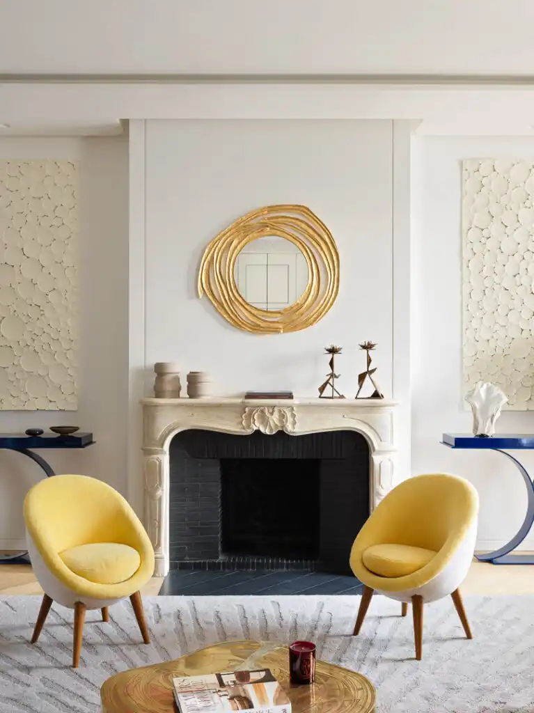 Living Room with yellow chairs and fireplace
