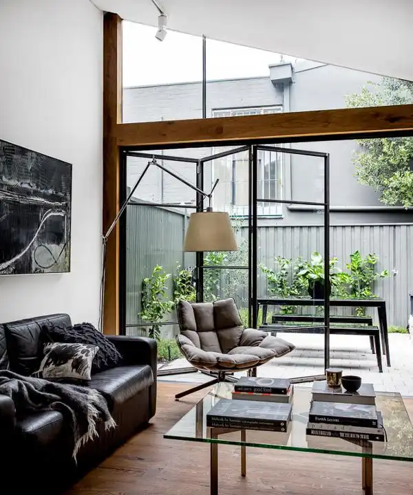 Living room with accordion windows