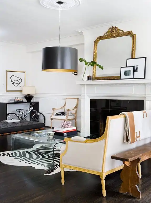 Living room with an animal skin rug on a dark floor