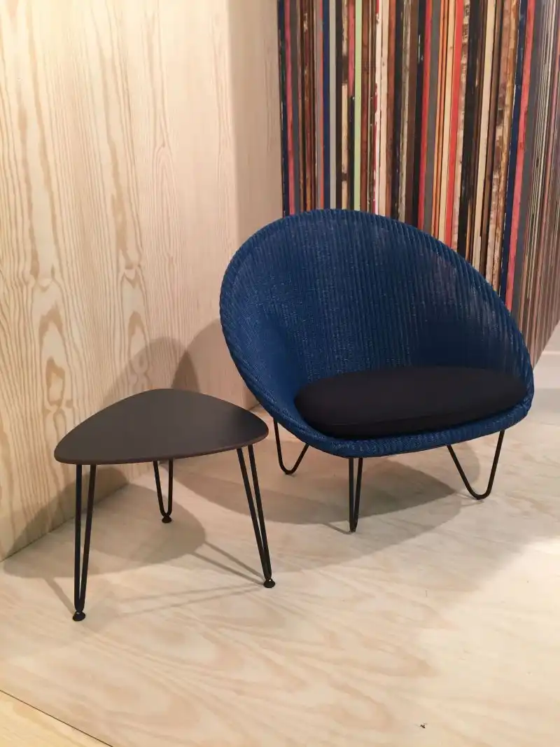 Low armchair with hairpin legs and coffee table
