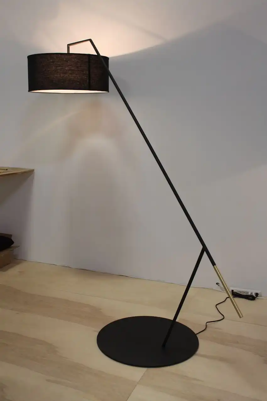 The 25/25 lamp by Ludwig and Larsen is made of powder-coated steel and brass and sports a linen shade. The south Brooklyn design and production studio specializes in custom lighting.
