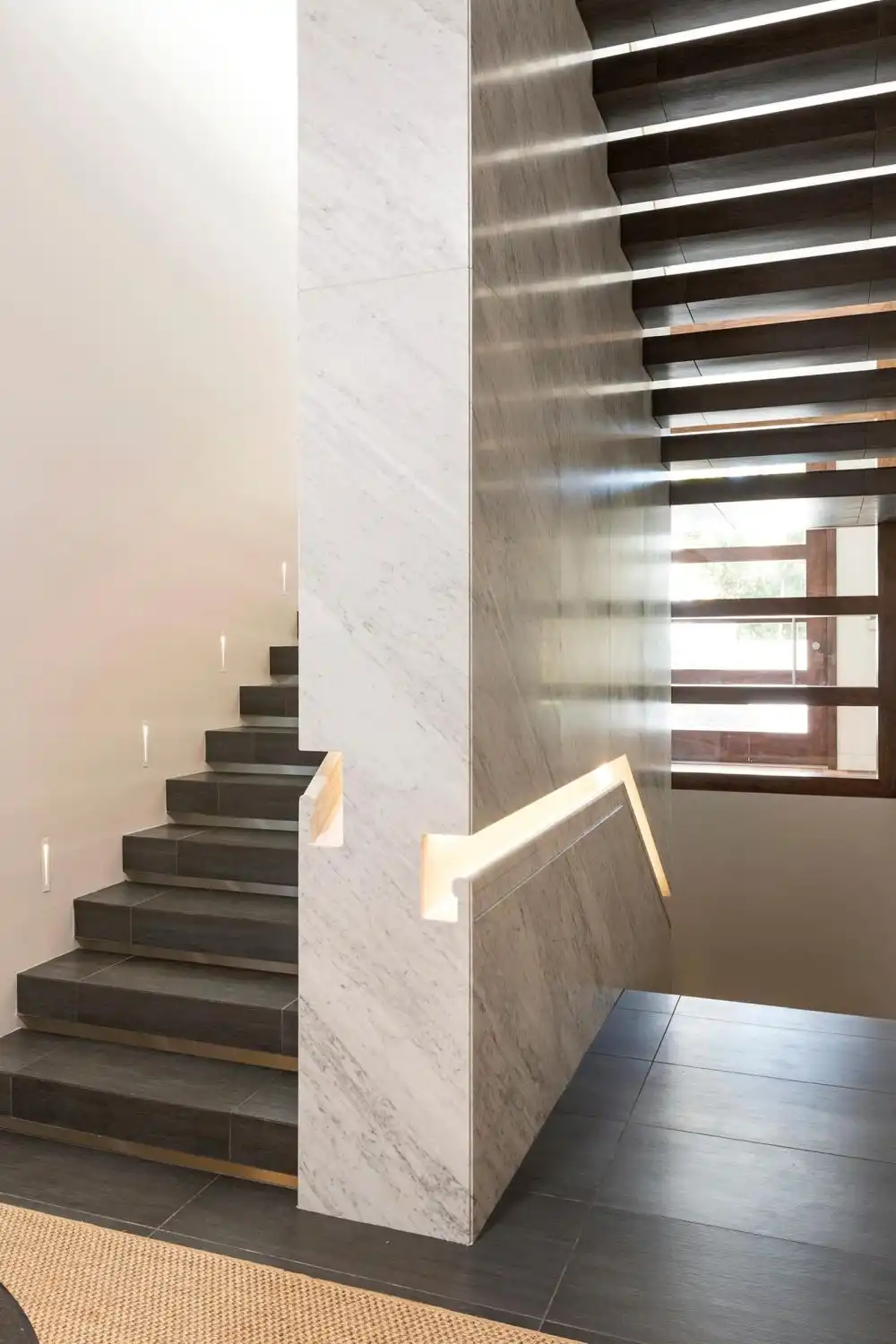 Marble wall staircase handrail built in